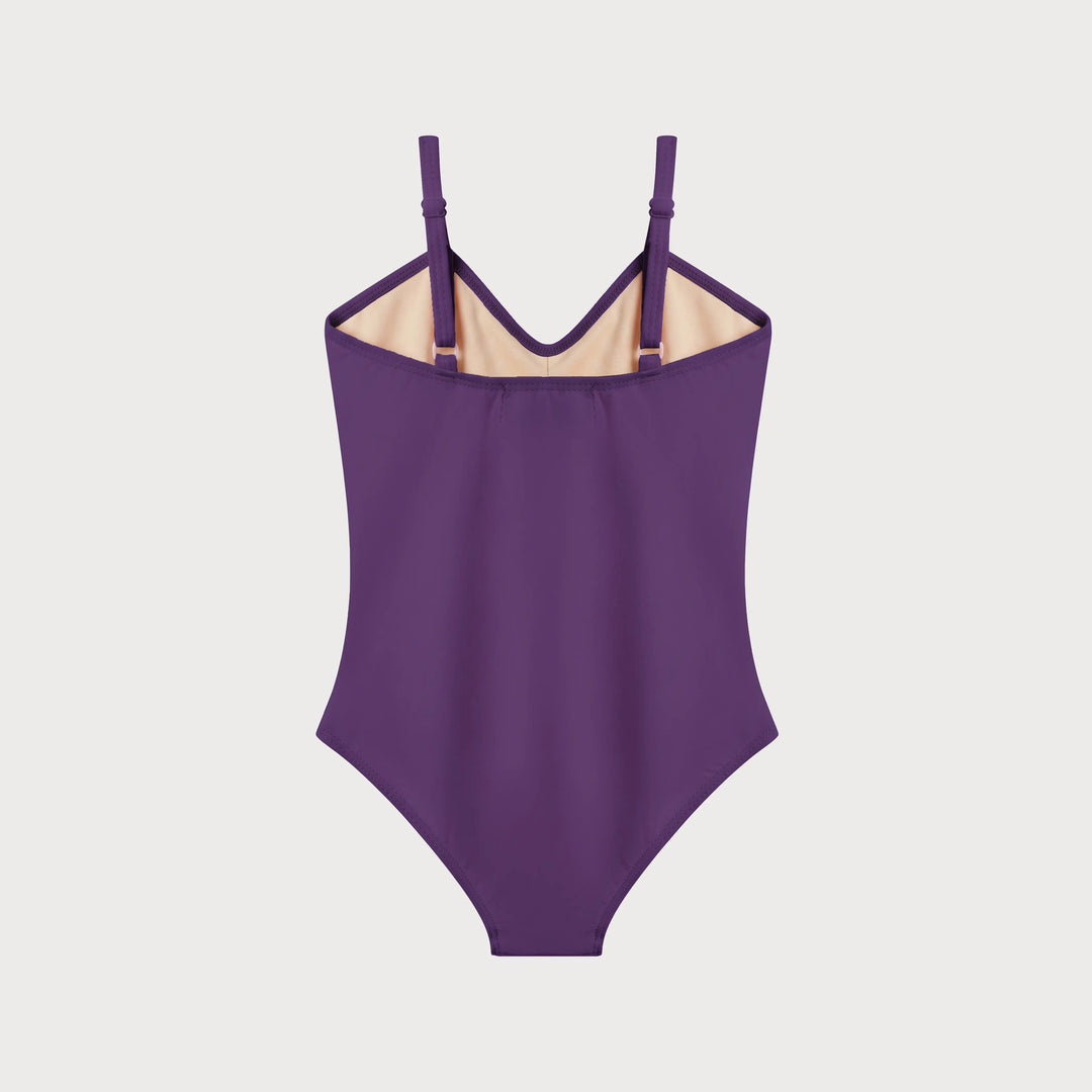 A purple one-piece swimsuit with thin shoulder straps and a beige inner lining, displayed flat against a light gray background.