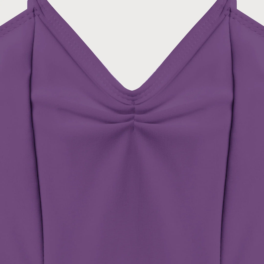 Close-up of a purple long-sleeve top with a V-neckline and gathered chest detail, shown against a light gray background.